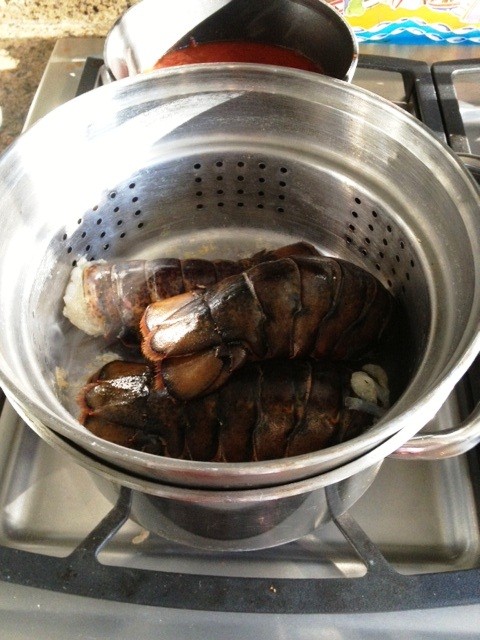 Lobster tails in a steamer, when they turn red, they're cooking.
