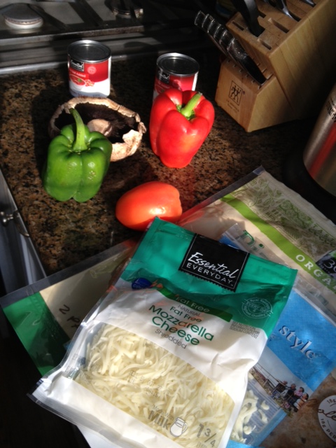 Starting ingredients --- peppers and mushrooms, no-fat cheese and a whole wheat low-salt pizza crust.