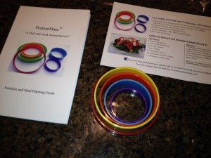 The PortionMate rings and meal planning booklet.