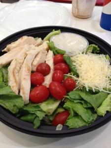This is what a Costco food court Caesar salad looks like when you unwrap it, a giant cup of fat-filled Caesar dressing and a mound of high-salt, high-fat grated cheese
