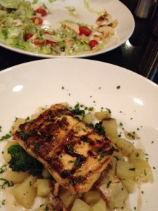 Salmon over potatoes and kale at 27Live