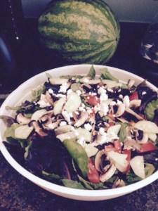 A July 4th salad with romaine lettuce, tomatoes, low-salt olives, fat-free feta, mushrooms and salmon.