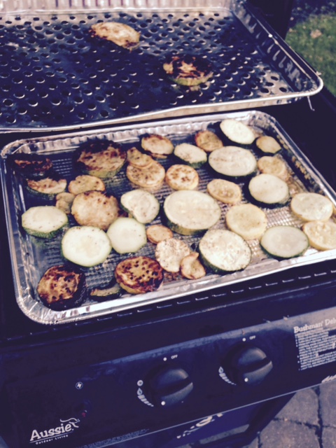 Zucchini on the gas grill, basted with olive oil and Italian spices.