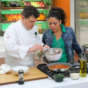 Recipe Rehab's Chef Richard and show host Evette Rios watching him make this tomato sauce.