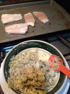 Mixing coating ingredients for the cod with the fillets in the background.