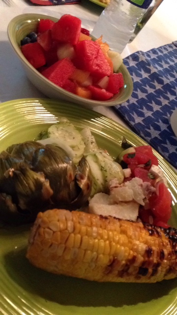 My grilled artichoke, along with corn, cucumber salad and tomato salad.